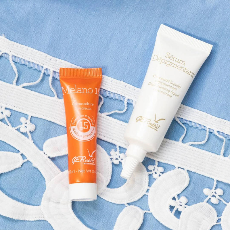 Šviesinimasis serumas + apsauga nuo saulės Melano 15